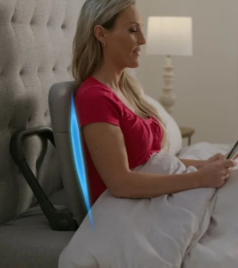 Woman sitting in bed with good posture using the Ready Rocker